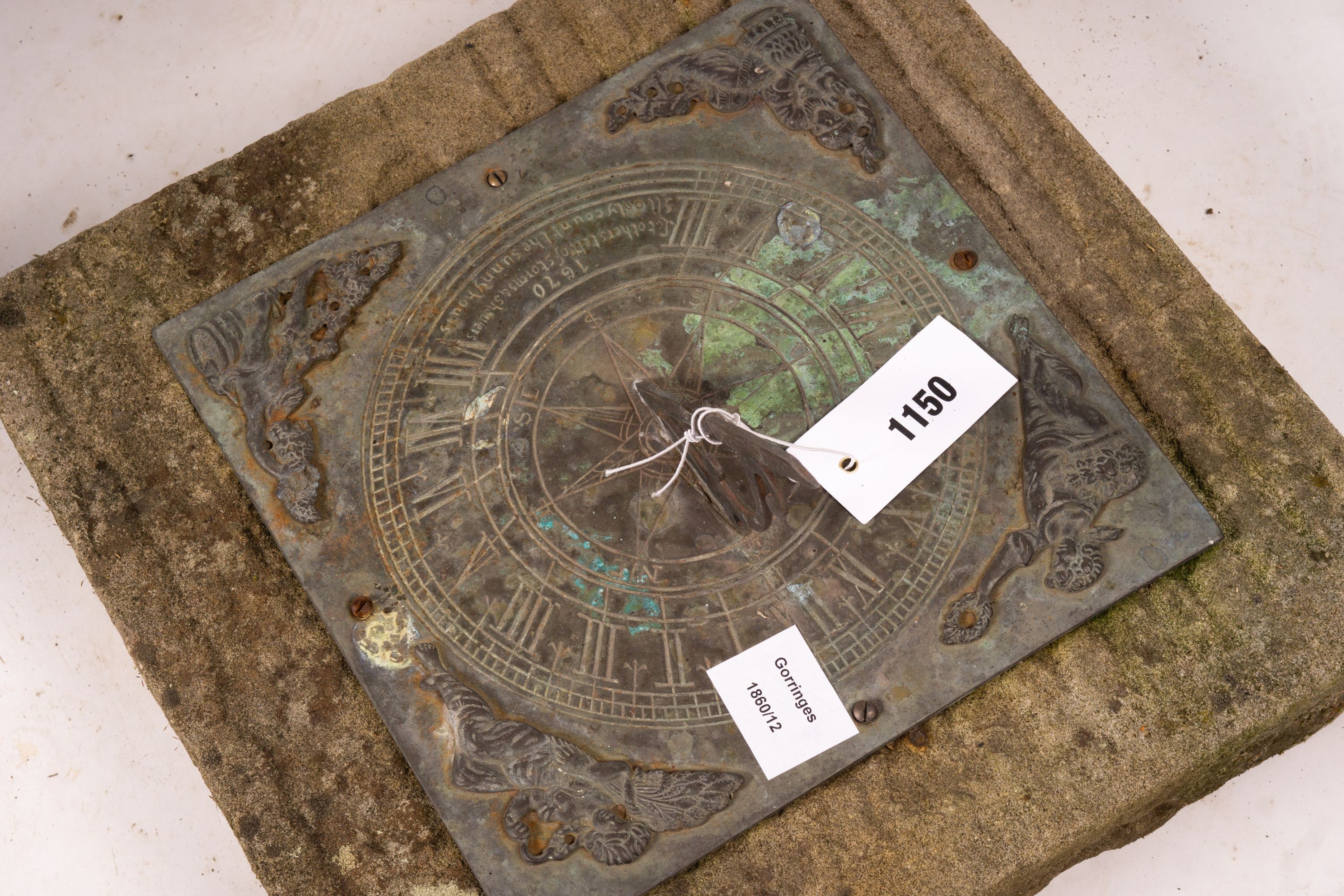 A 17th century style sun dial on Portland stone plinth, height 70cm